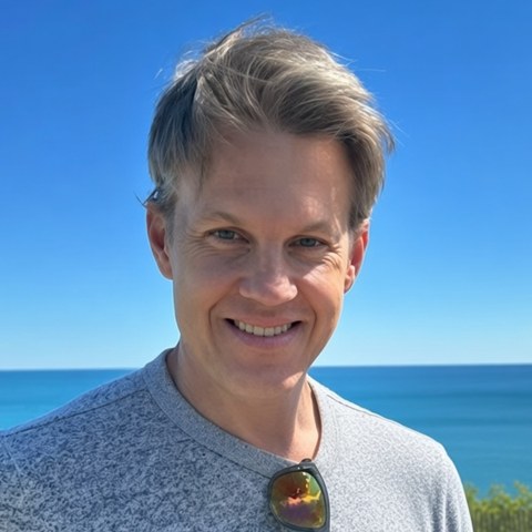 Dan, editor at The Sheridan Review, on the Lake Michigan shoreline
